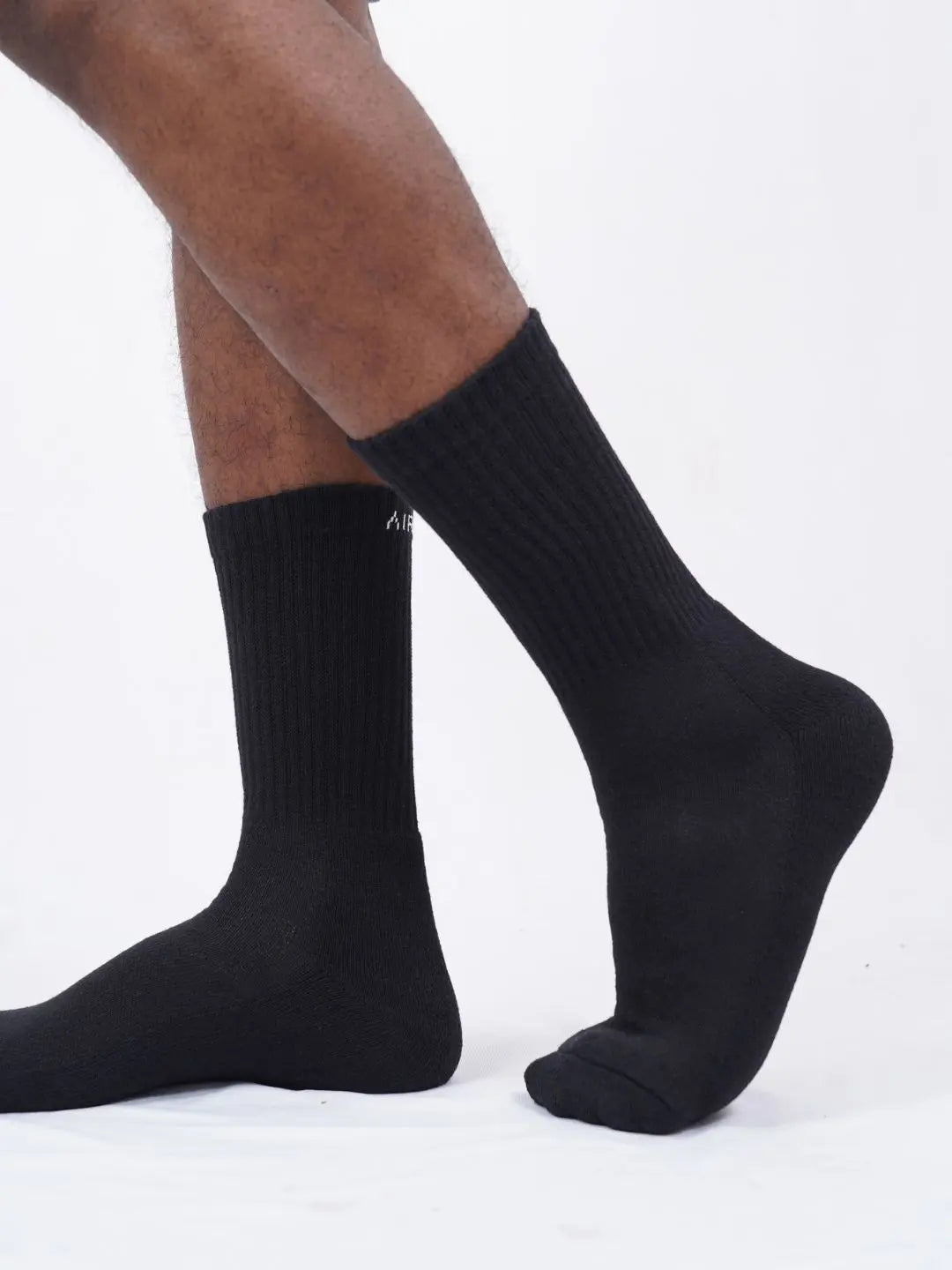 Three pairs of black crew length cotton socks with cushioning for both men and women by Air Garb